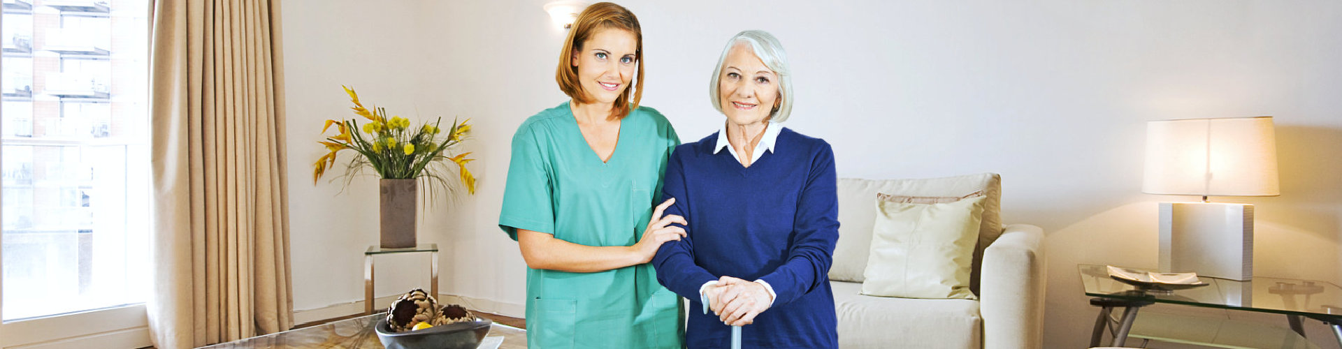 caregiver and senior woman standing